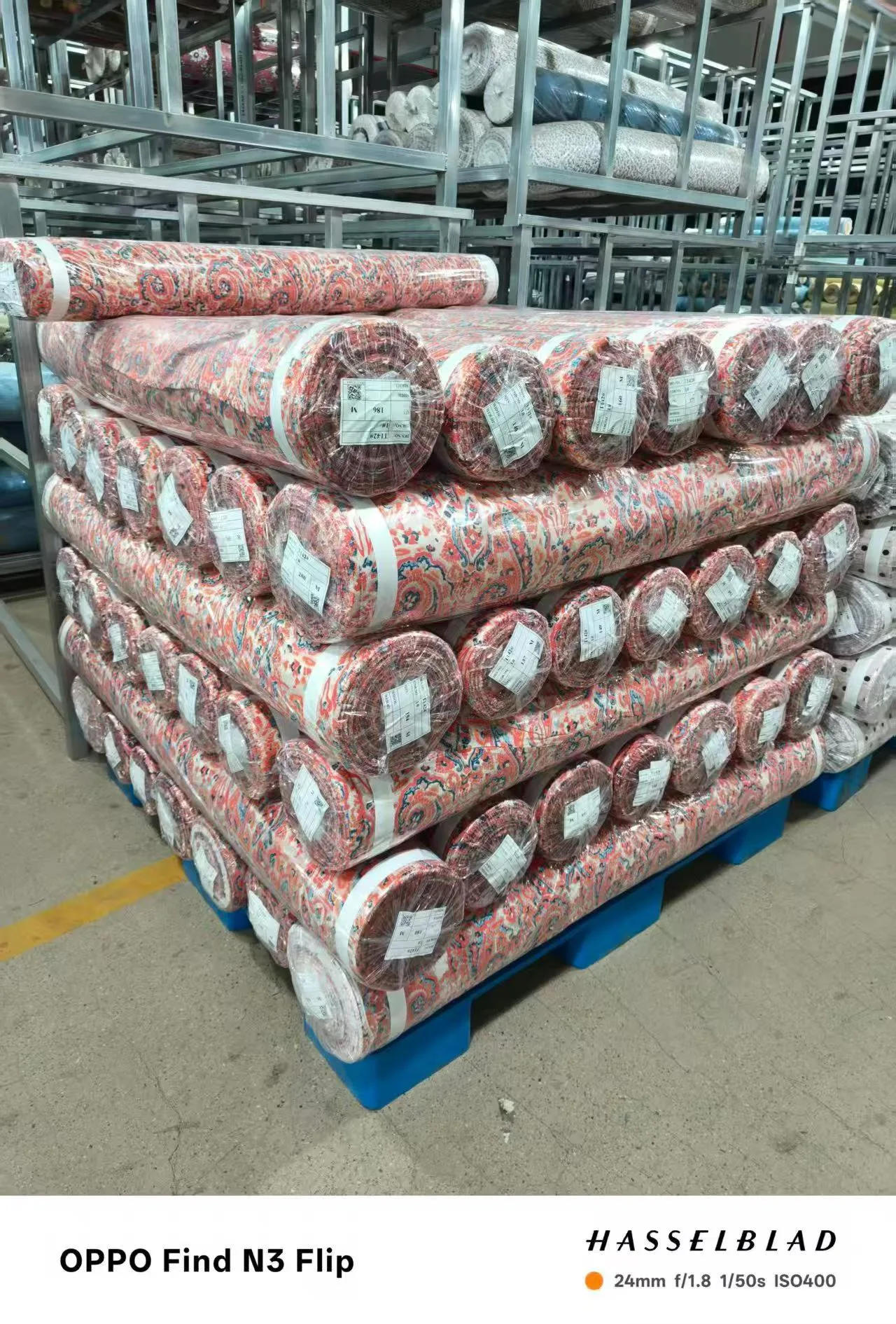 Printed rayon rolls staged for export at the Sora Fabrics warehouse in China
